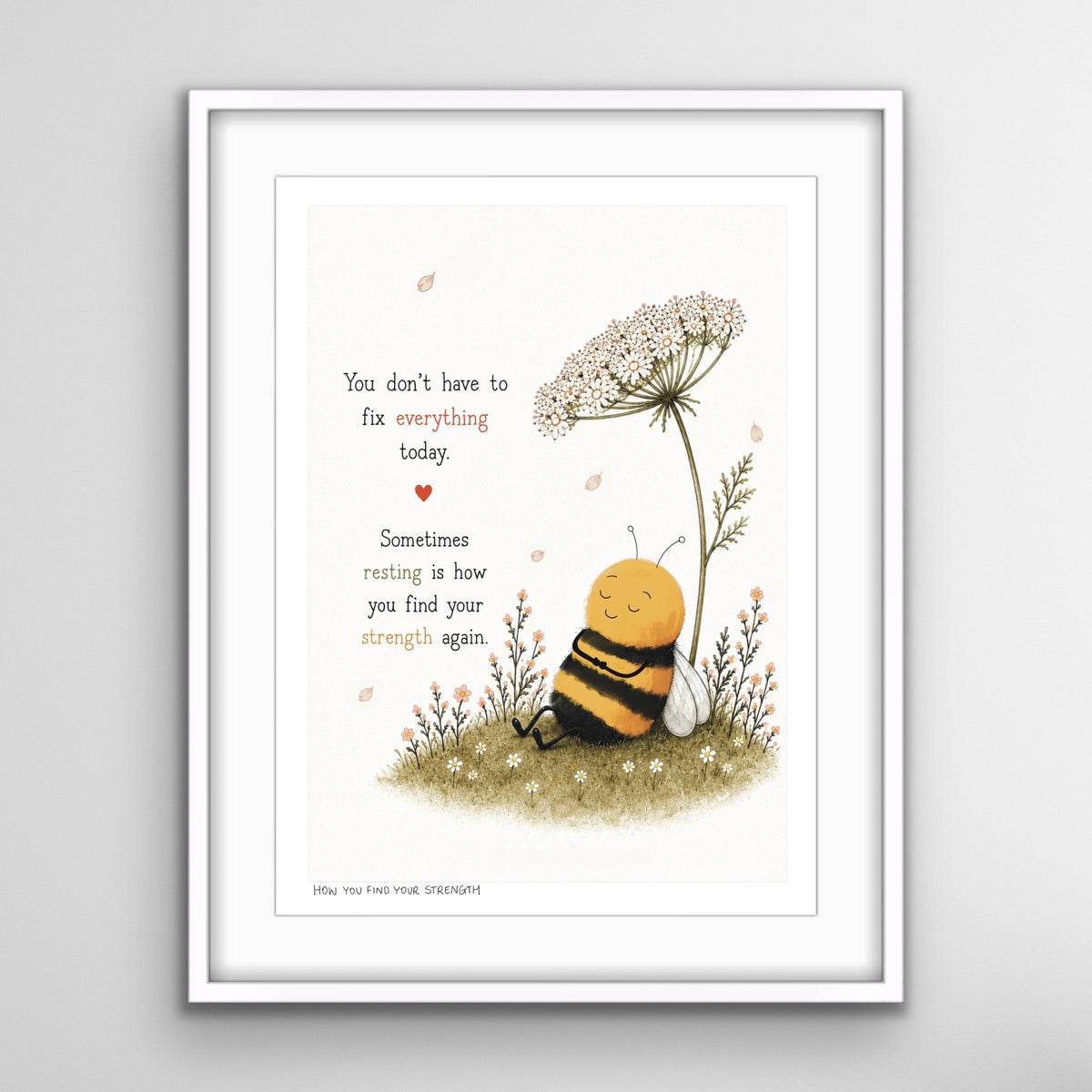 A framed fine art print featuring a peaceful illustrated bee resting beneath wildflowers with the words, “You don’t have to fix everything today. Sometimes resting is how you find your strength again.”