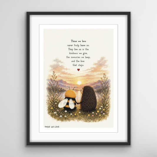 A remembrance art print featuring a bee and hedgehog sitting together among wildflowers, watching a sunset over the mountains, with the words “Those we love never truly leave us”.