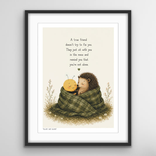 You’re Not Alone friendship print featuring the Bee and Hedgehog wrapped together in a cosy blanket